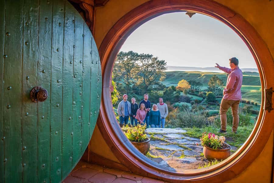 Auckland: Hobbiton Movie Set Day Trip with Festive Lunch - Entering a real Hobbit hole on Bagshot Row