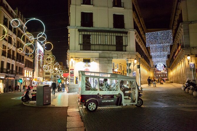 Christmas Lights Tour of Madrid in Eco Tuk Tuk Private - The Prado and San Jerónimo church after dark
