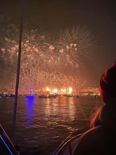 Lisbon: NYE Fireworks Catamaran Cruise with Food & Drinks - From the Discoveries Monument to 25 de Abril Bridge