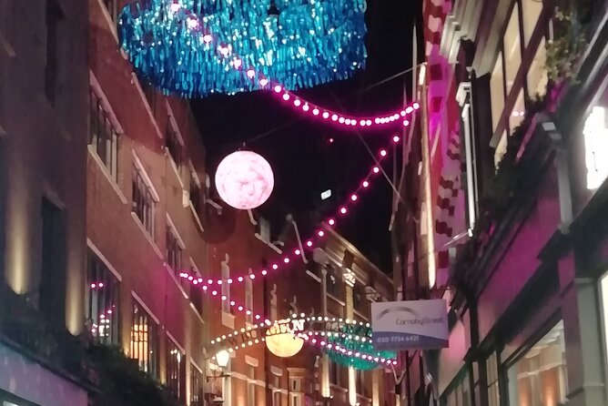 London Private Christmas Lights Walking Tour with Local Guide - Bond Street combines lights with luxury storefronts