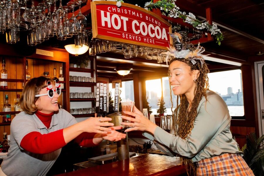 NYC: Night Holiday Lights and Cocoa Cruise - Boarding a 1920s-style yacht