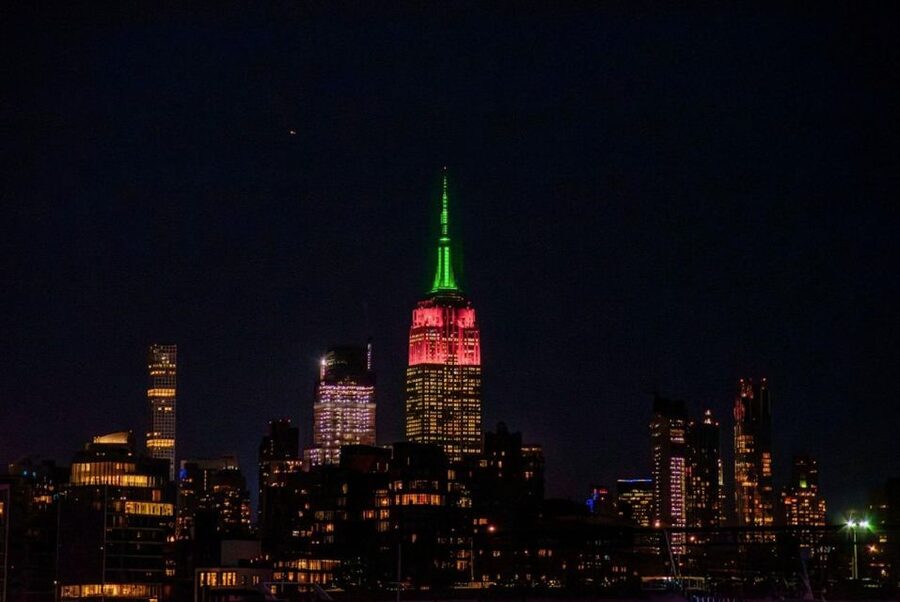 NYC: Night Holiday Lights and Cocoa Cruise - Ellis Island and the Statue of Liberty after dark